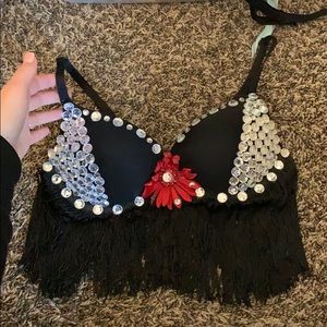 Black rhinestone rave bra with a red daisy